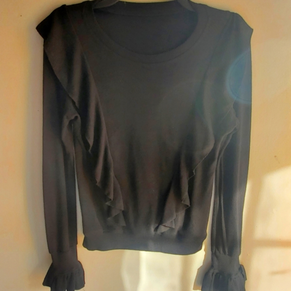 Black sweater with ruffles